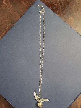 Silver Winged Pendant Necklace with Gold Orb - Women's Jewelry